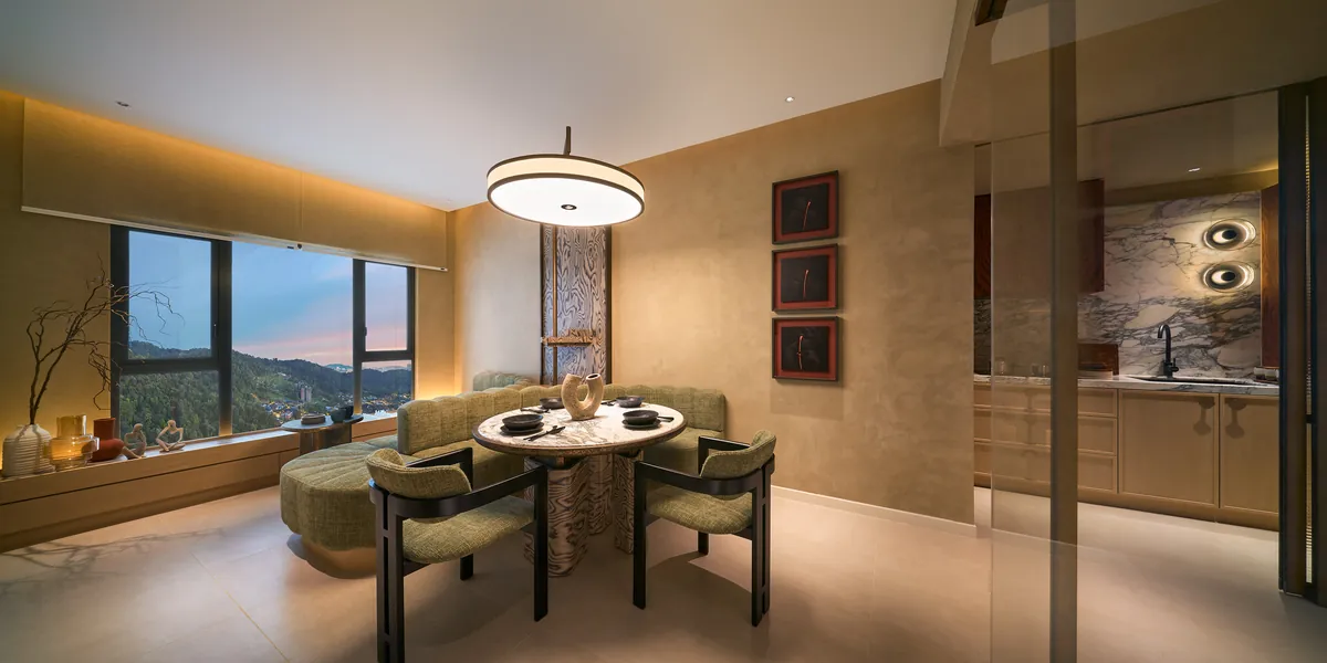 Type A dining table under a disc pendant, the window framing the valley