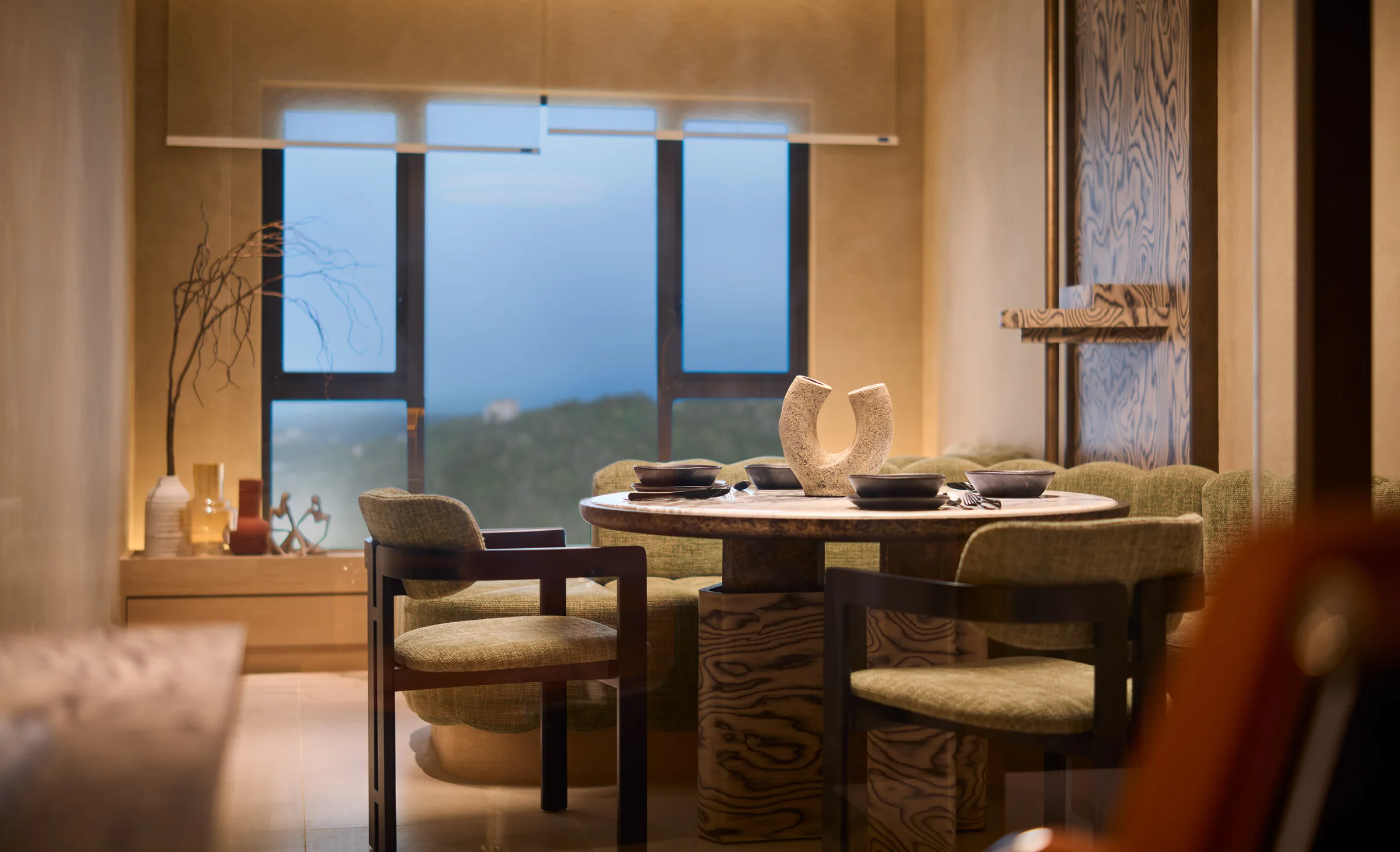 Type A dining setting at the window, hills and sky beyond